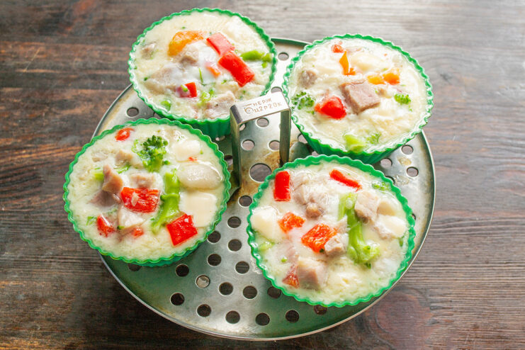 Perfectly Steamed Omelet Muffins Ready to Serve Freshly steamed omelet muffins in silicone molds, ready to be served for breakfast.