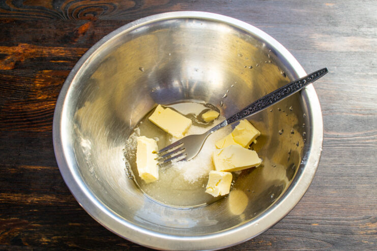 Step 1: Creaming butter and sugar for the cookie dough A bowl with cubed softened butter and sugar, ready for mixing.