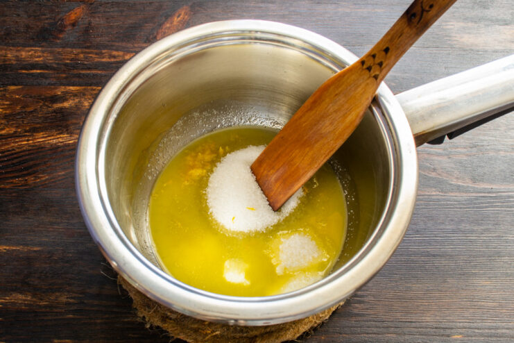 Zesting a lemon for the nut filling Zesting a lemon with a fine grater to add flavor to the filling.
