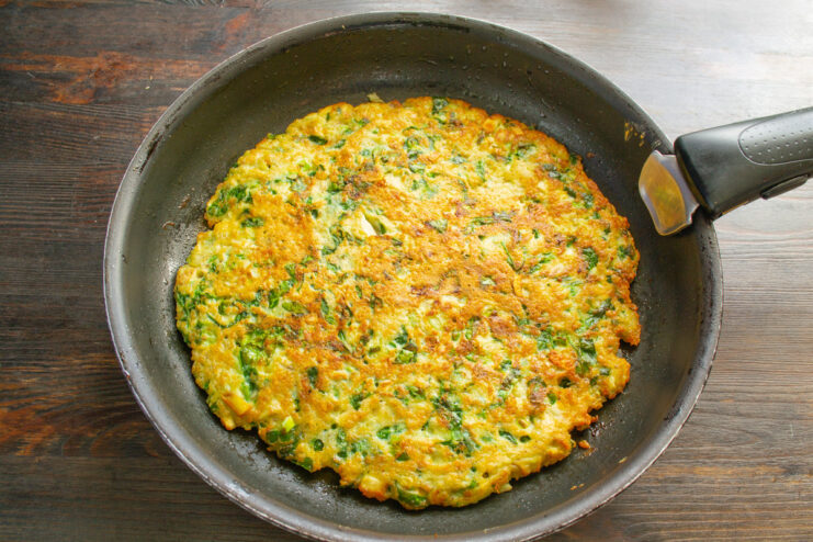 A Clever Trick to Flip the Delicate Oatmeal Pancake Demonstrating the plate method to flip the large, delicate oatmeal pancake.