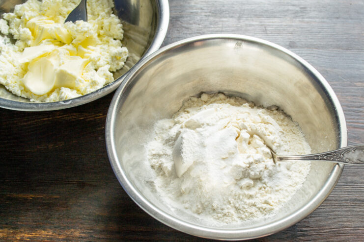 Whisking together flour, baking powder, and vanilla for the cookie recipe. A bowl containing the mixed dry ingredients: flour, rice flour, and baking powder.
