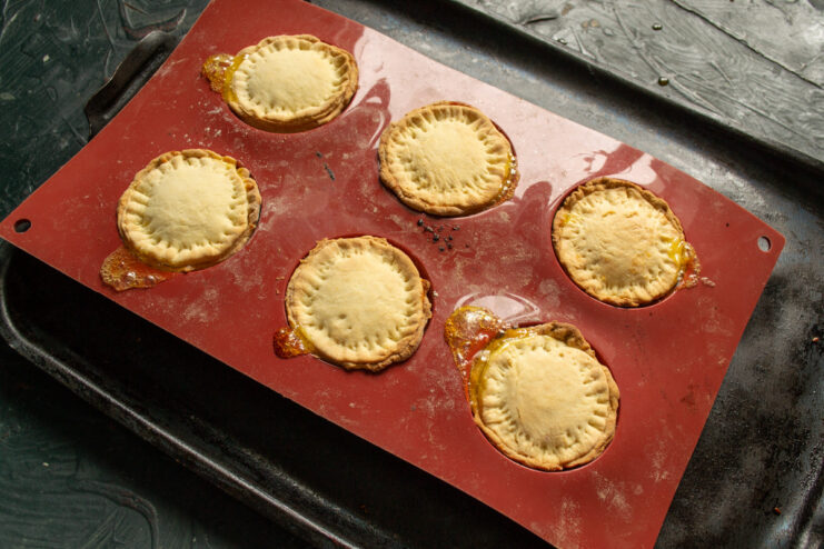 Baking the Orange Marmalade Cookies Until Golden The silicone mold with uncooked cookies ready to be placed in the oven.