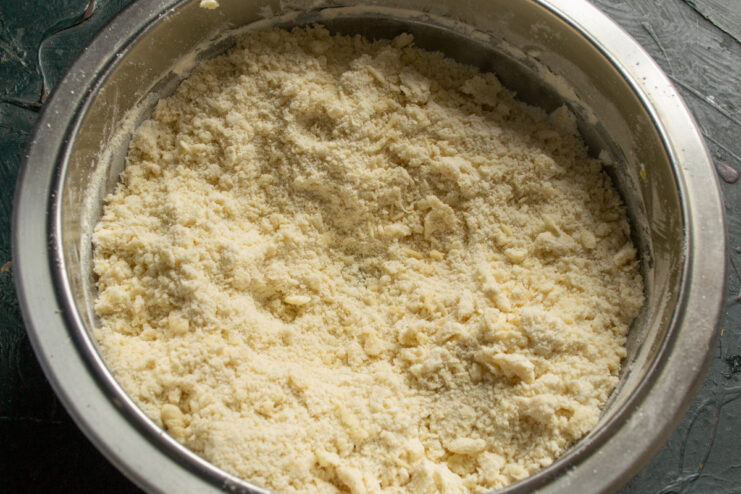 Creating a Crumbly Texture for Shortcrust Pastry Butter and flour mixture being processed into fine crumbs.