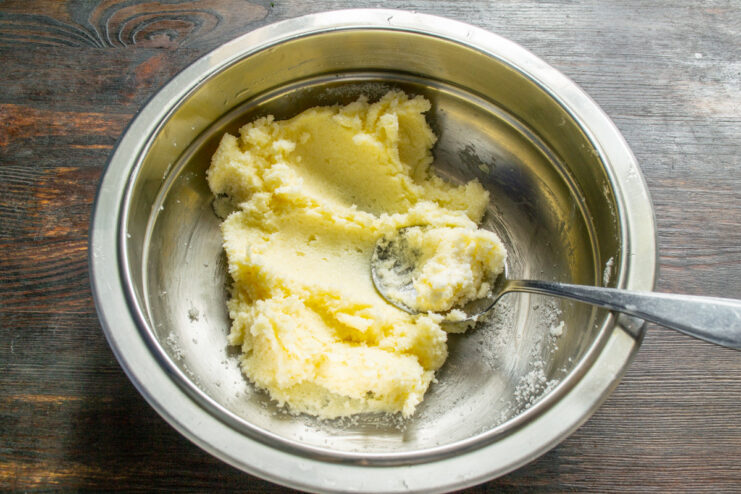 Step 1: Creaming the butter and sugar for the cookie dough. A bowl with softened butter and granulated sugar, ready for mixing.