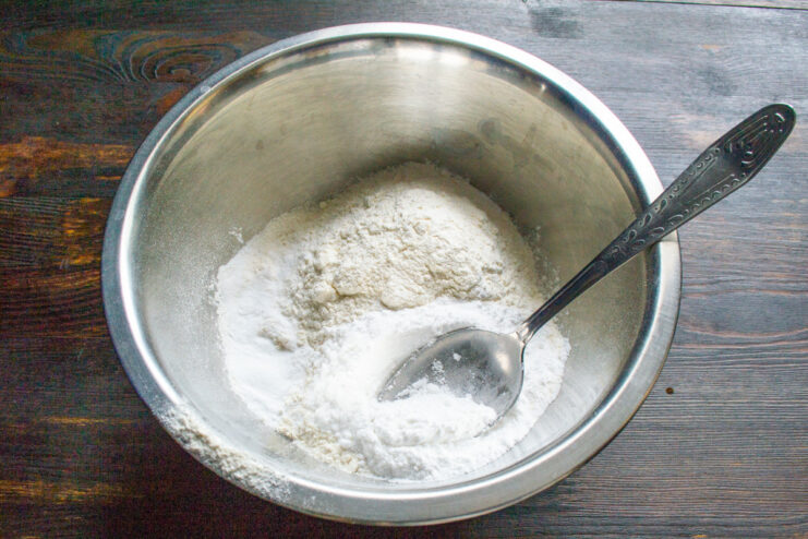 Preparing the Buttery Shortcrust Pastry Ingredients for the shortcrust pastry: flour, sugar, and butter in a bowl.