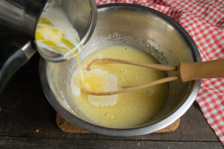 Step 3: Melting Butter in a Saucepan Butter melting in a small, heavy-bottomed saucepan on a stove.