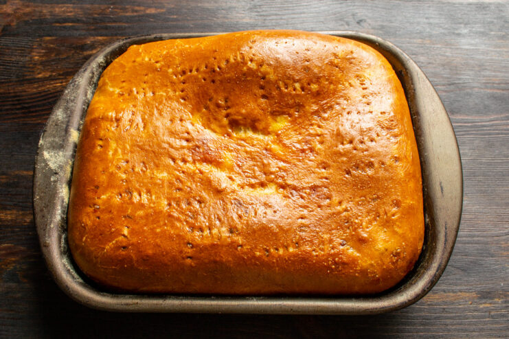 Freshly Baked Cabbage Pie Straight from the Oven A perfectly baked, golden-brown cabbage pie cooling after being taken out of the oven.