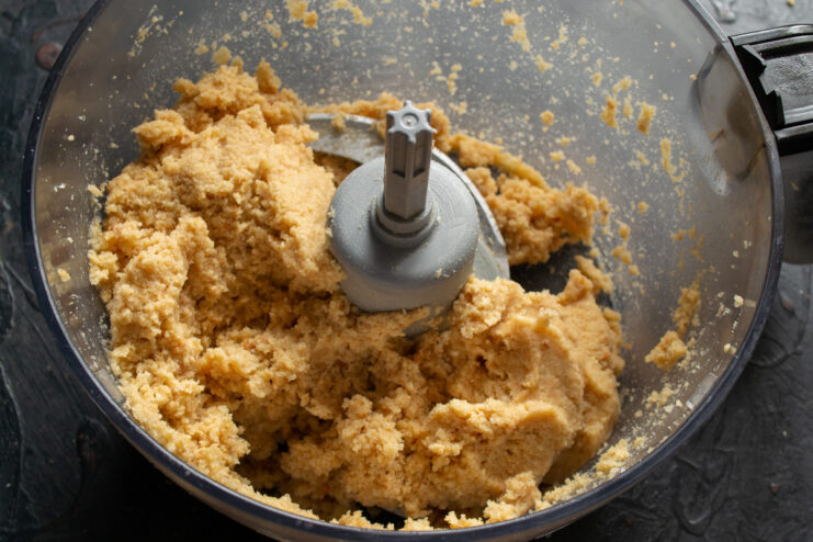 Mixing all ingredients for the Kartoshka cakes All ingredients for the chocolate potato cakes being mixed together in a bowl.