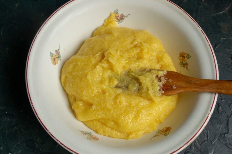 The Texture of Freshly Cooked Polenta A pot of thick, freshly cooked polenta, ready for the next steps.