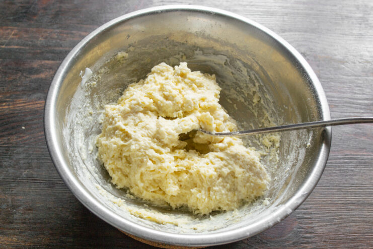 Simple Batter for Fluffy Oladyi Pancakes A bowl of batter for oladyi, a type of small, thick pancake.