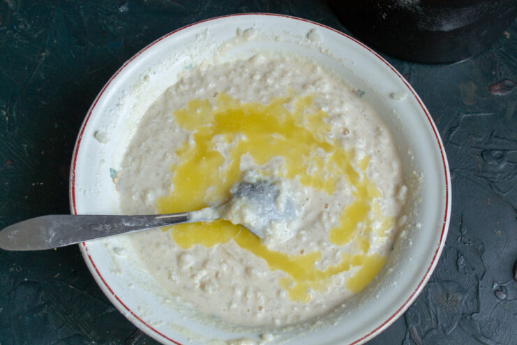 Step 5: Using cornstarch or flour as a binding agent for the casserole. Cornstarch being added to the casserole batter in a bowl.