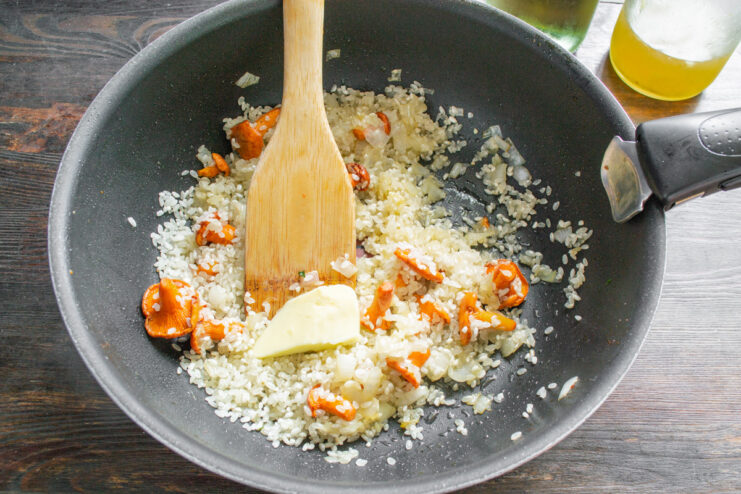 Coating Each Grain of Rice with Butter and Flavor Stirring Arborio rice in a skillet to toast it with butter, onions, and chanterelles.