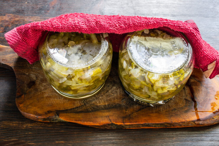 The 'Fur Coat' Method: A Traditional Way to Pasteurize Canned Goods Inverted jars of cucumber salad wrapped in a thick blanket to cool slowly and self-pasteurize.