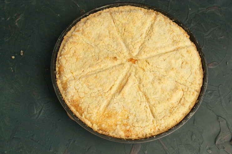 Baking the Pie to Golden Perfection The grated cottage cheese pie baking in the oven, turning golden brown.