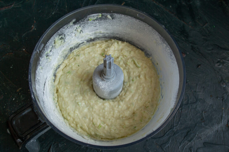 Mix the batter well and let it rest in the fridge for 15 minutes to develop flavor. A bowl of well-mixed zucchini pie batter, ready to be chilled.