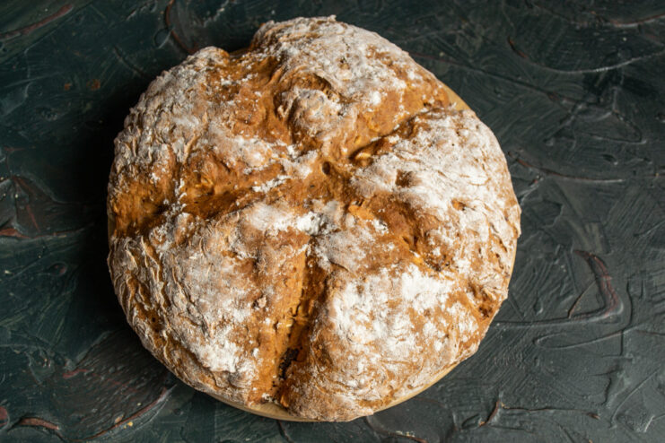Final step: Cooling the baked soda bread on a rack before slicing. The freshly baked sweet soda bread cooling on a wire rack.