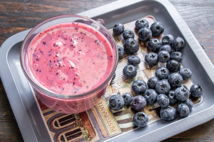 The Finished Smoothie: Ready to Serve or Chill Two glasses filled with the freshly blended purple banana and blueberry smoothie.