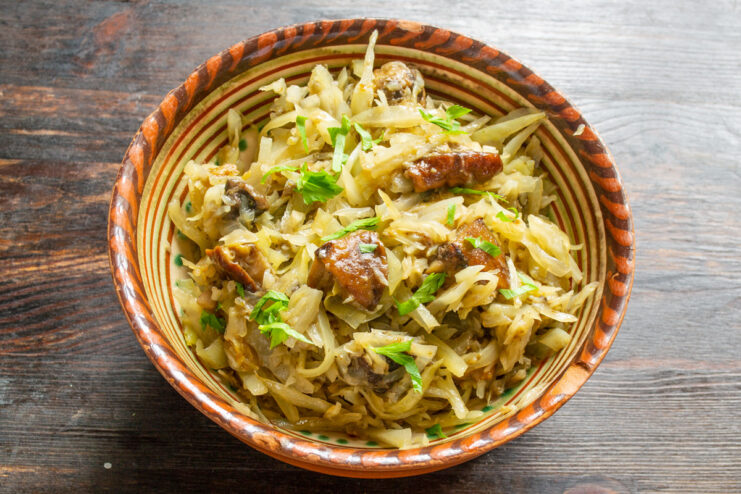 A final plated serving of braised cabbage with mushrooms, ready to eat.