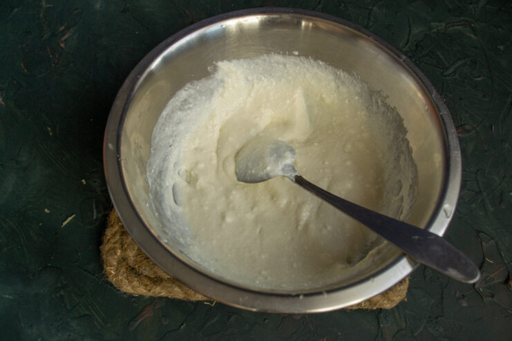 Achieving a smooth filling: Whisking the cottage cheese mixture until lump-free. Whisking the creamy cottage cheese filling in a glass bowl until smooth.