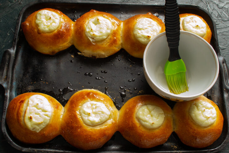 Glazing Hot Vatrushki with Sugar Syrup Brushing freshly baked, hot Vatrushki with a shiny sugar syrup glaze.