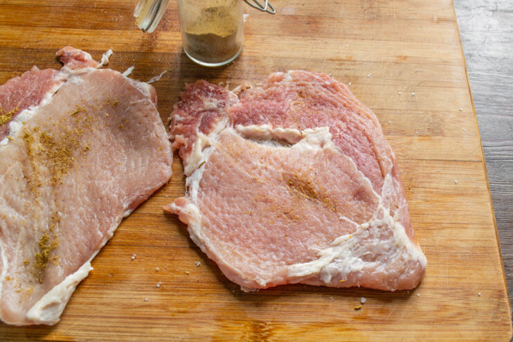 Seasoning the Pounded Pork Cutlet Seasoning a thin, pounded pork cutlet with salt and pepper.