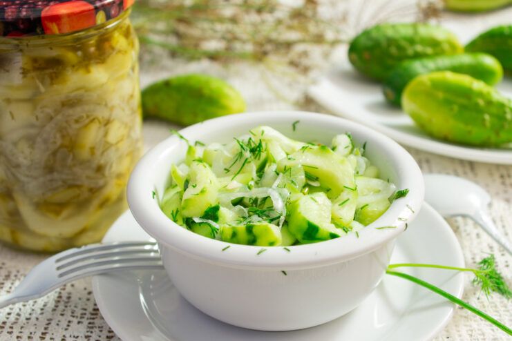 A jar of preserved overgrown cucumber salad, ready for storage.