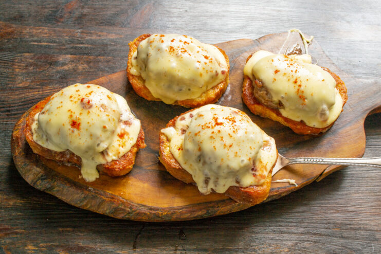 Serve Hot for the Ultimate Comfort Food Experience A close-up of a finished pan-baked minced meat sandwich with perfectly melted cheese.