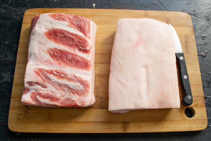 Choosing the Best Pork Fat for Curing Salo A large, thick slab of raw pork fatback with skin, ready for curing.