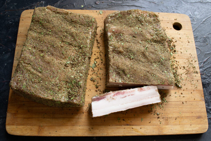 Storing Homemade Salo for Long-Term Enjoyment Finished, cured salo, sliced thinly and ready to be stored or eaten.