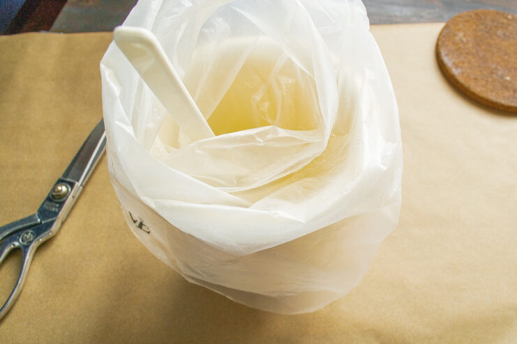 Setting up your zefir-making station A piping bag with a star tip set in a tall glass, ready for the zefir mixture.