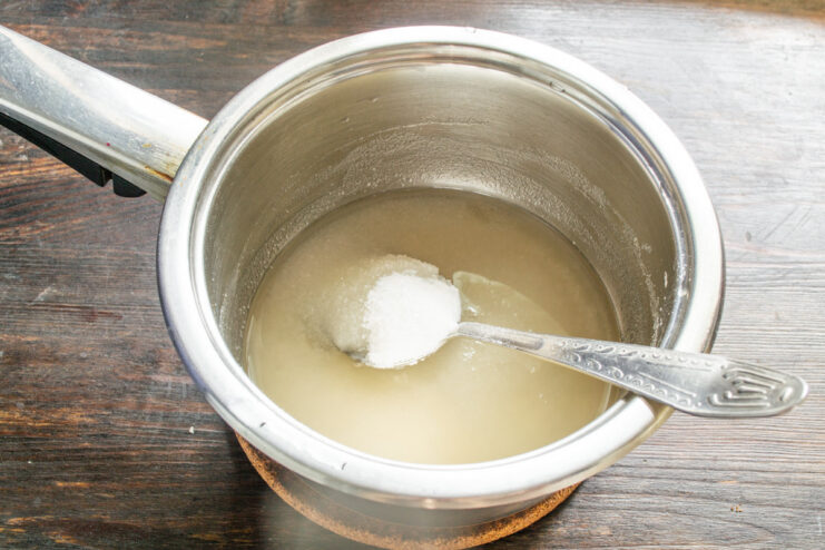 Blooming the agar-agar for the syrup A saucepan with water and agar-agar powder before heating.