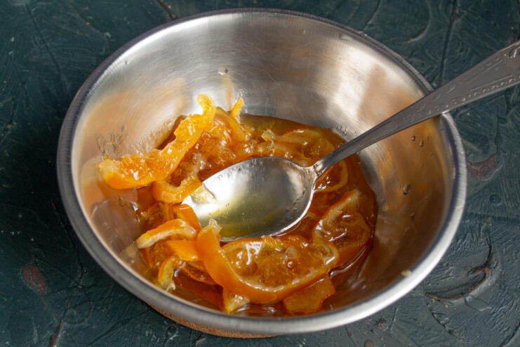 Preparing The Marmalade Homemade orange marmalade with citrus peels in a small bowl