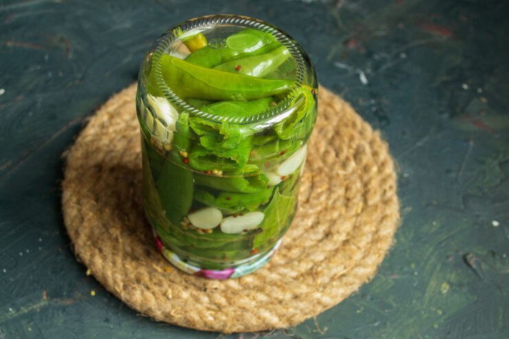 Pasteurizing the preserve Sealed jar of chili peppers flipped upside down for pasteurization