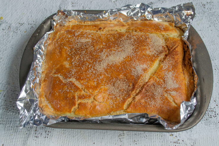 Baked Pie Whole baked farmer cheese pie in a rectangular pan straight from the oven.
