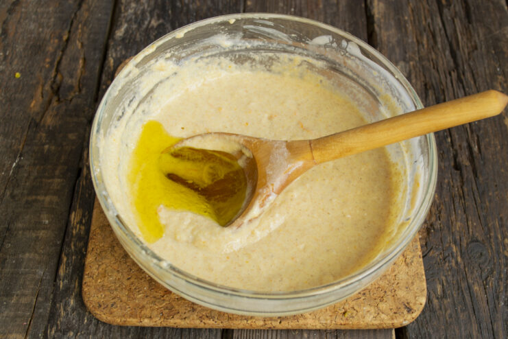 Folding in Olive Oil Pouring olive oil into the pancake batter