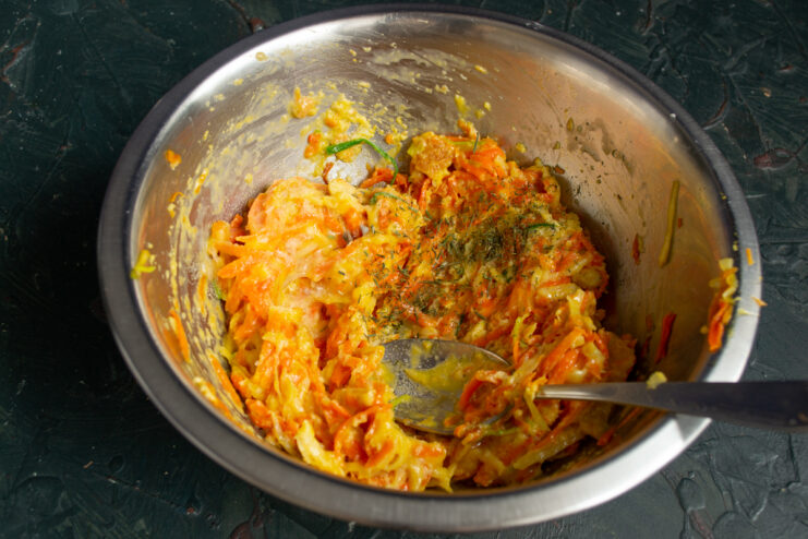 Adding spices and dried dill to the batter