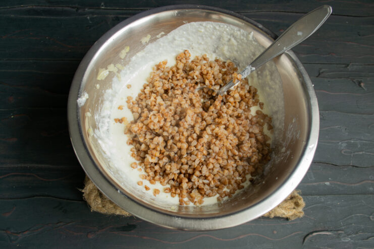 Adding cooked buckwheat Folding cooked buckwheat into the blended cheese mixture
