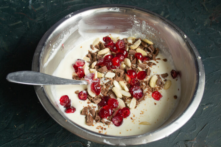 Adding Berries or Candied Fruit Adding dried cranberries or cherries to the bowl with the cheesecake filling