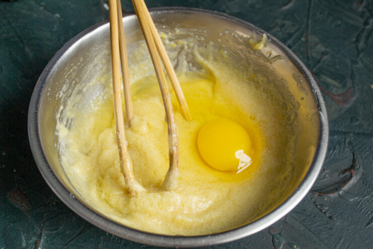 Incorporating The Egg Mixing a large egg into the butter and honey mixture