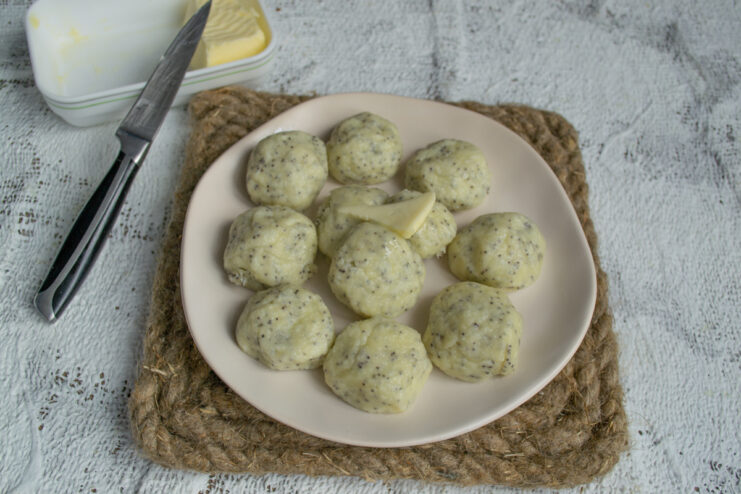 Serving with butter Hot steamed dumplings topped with pieces of melting butter