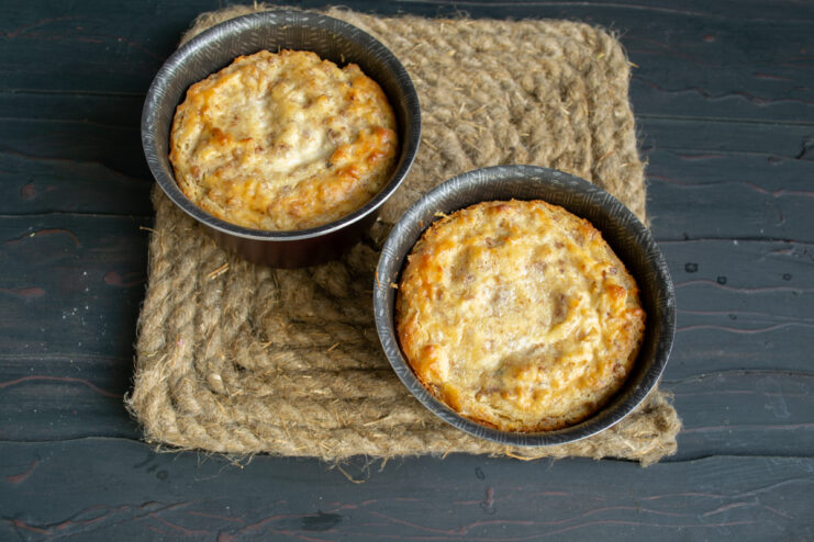 Freshly baked krupenik Golden brown freshly baked buckwheat and cheese bakes in ramekins