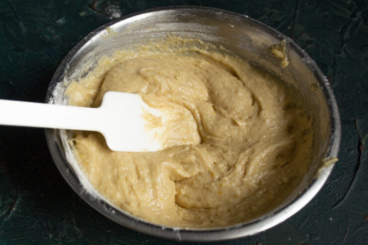 Checking Batter Consistency Smooth and thick muffin batter ready for baking in a mixing bowl