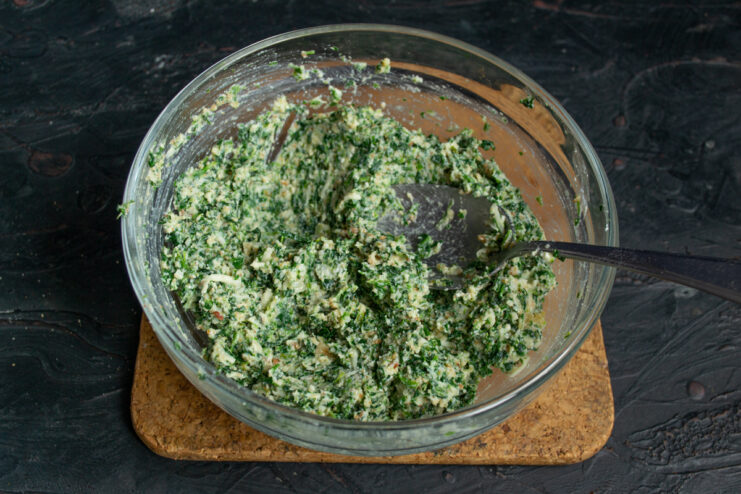 Fully mixed spinach and cheese mixture ready for shaping
