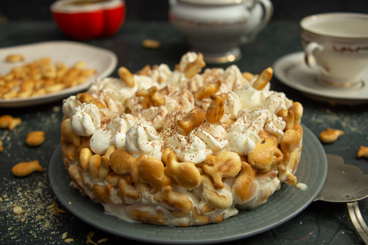 Finished no-bake fish cracker cake with sour cream and condensed milk decorated with whipped cream