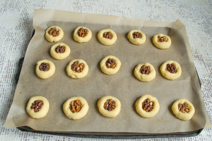 Decorating with walnuts Walnut halves pressed into the center of shortbread dough balls