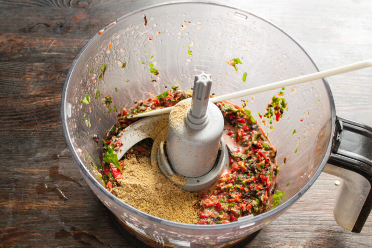 Mixing In The Spices Blended vegetable paste mixed with khmeli suneli spice blend