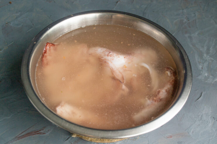 Thawing the Squid Squid thawing in a container of cold water