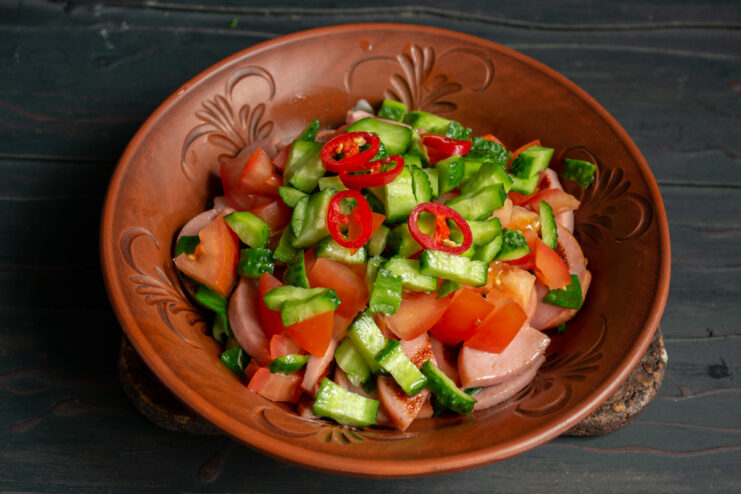 Adding Some Heat Red chili pepper rings sprinkled over the salad