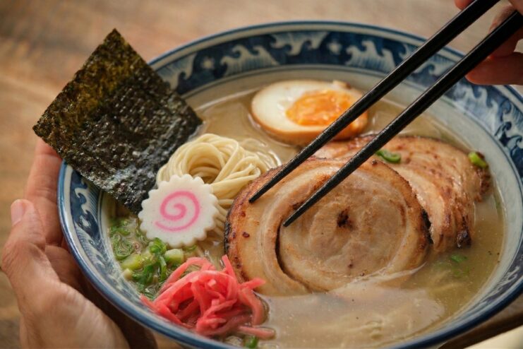 Proper ramen assembly Close-up view of ramen assembly featuring nori, narutomaki, and chashu meat