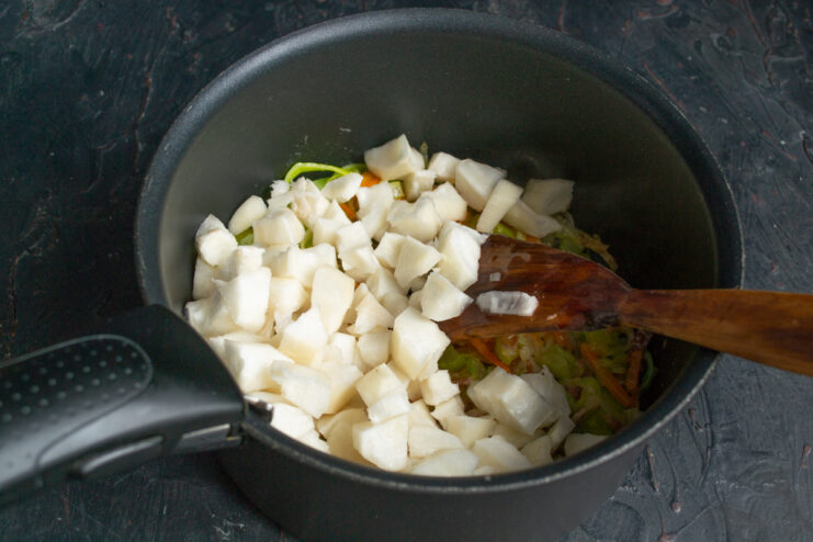 Adding Jerusalem artichoke for a nutty flavor Diced peeled Jerusalem artichokes added to the pot with cooked vegetables